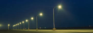 Streetlights along a road at night.